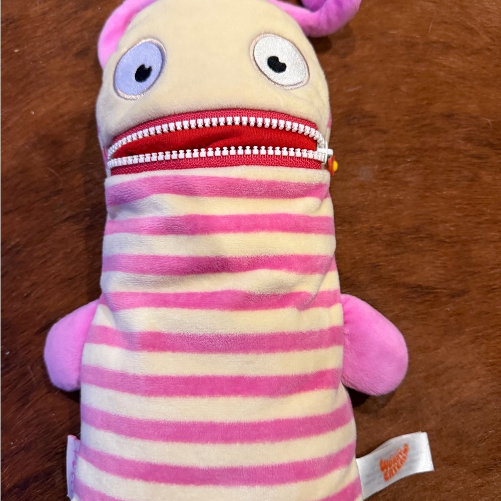 Whimsical Pink and Cream Striped Plush Toy